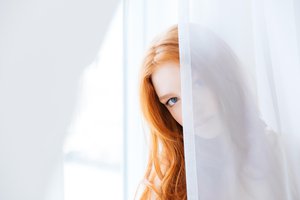 behind