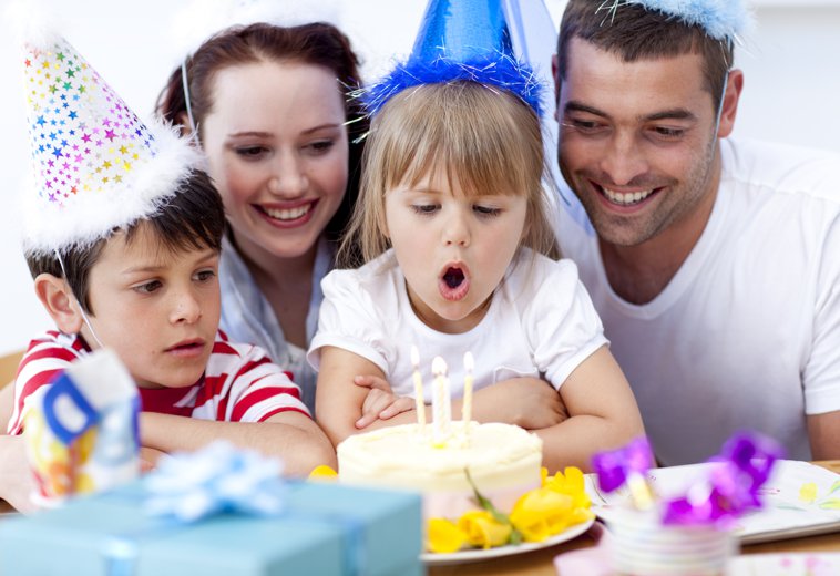 latino family celebrating girl's birthday