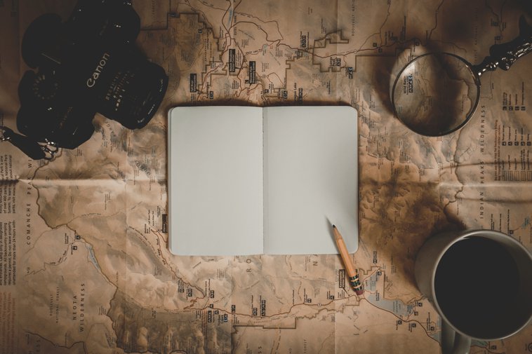 blank journal on a map