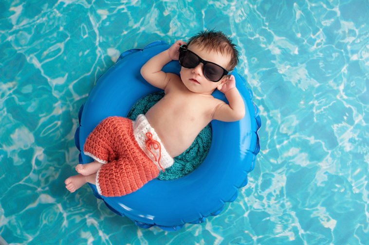 cool baby relaxing in a pool