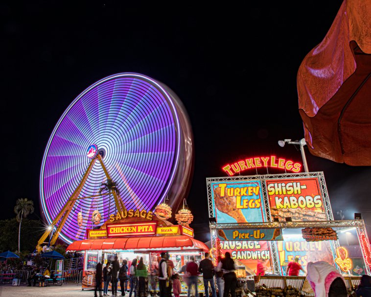 fair at night with food stands