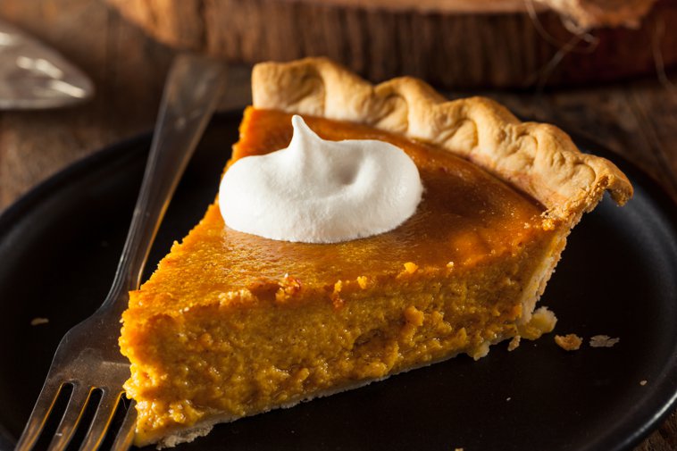 slice of pumpkin pie with whipped cream